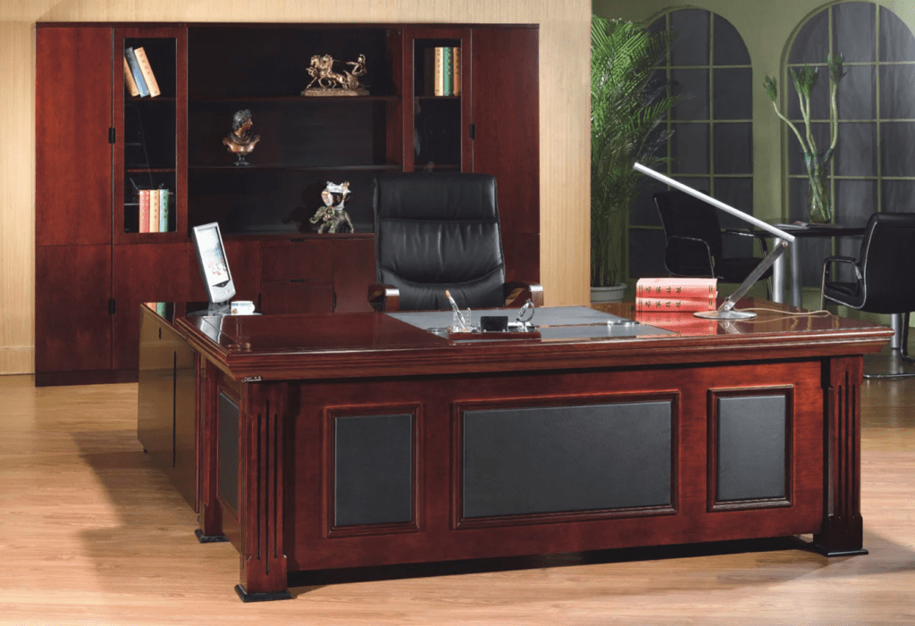a really fancy mahogany desk, in a similarly snazzy room