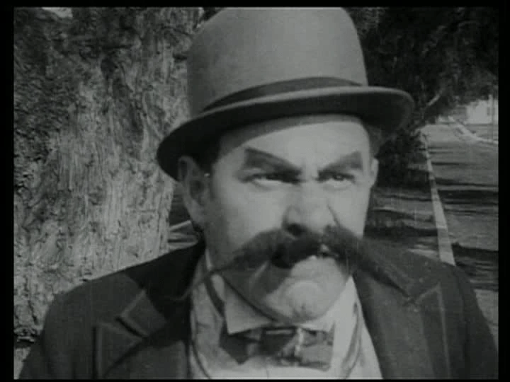 a silent movie type villain